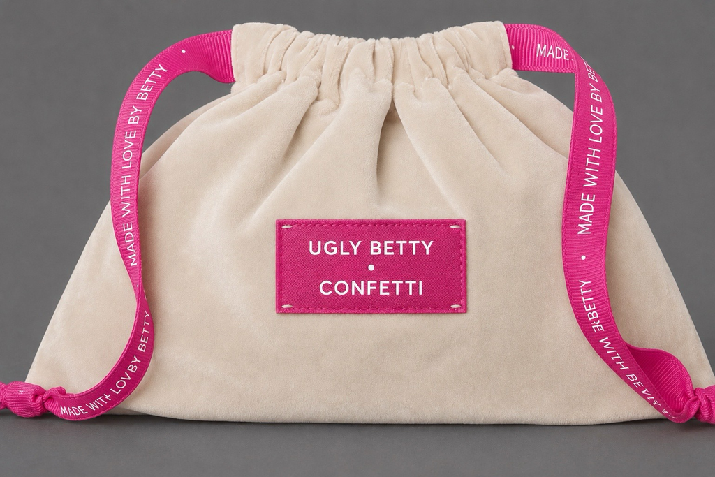 Betty's Confetti Bag, cream velvet drawstring bag with hot pink silk lining by Ugly Betty Confetti
