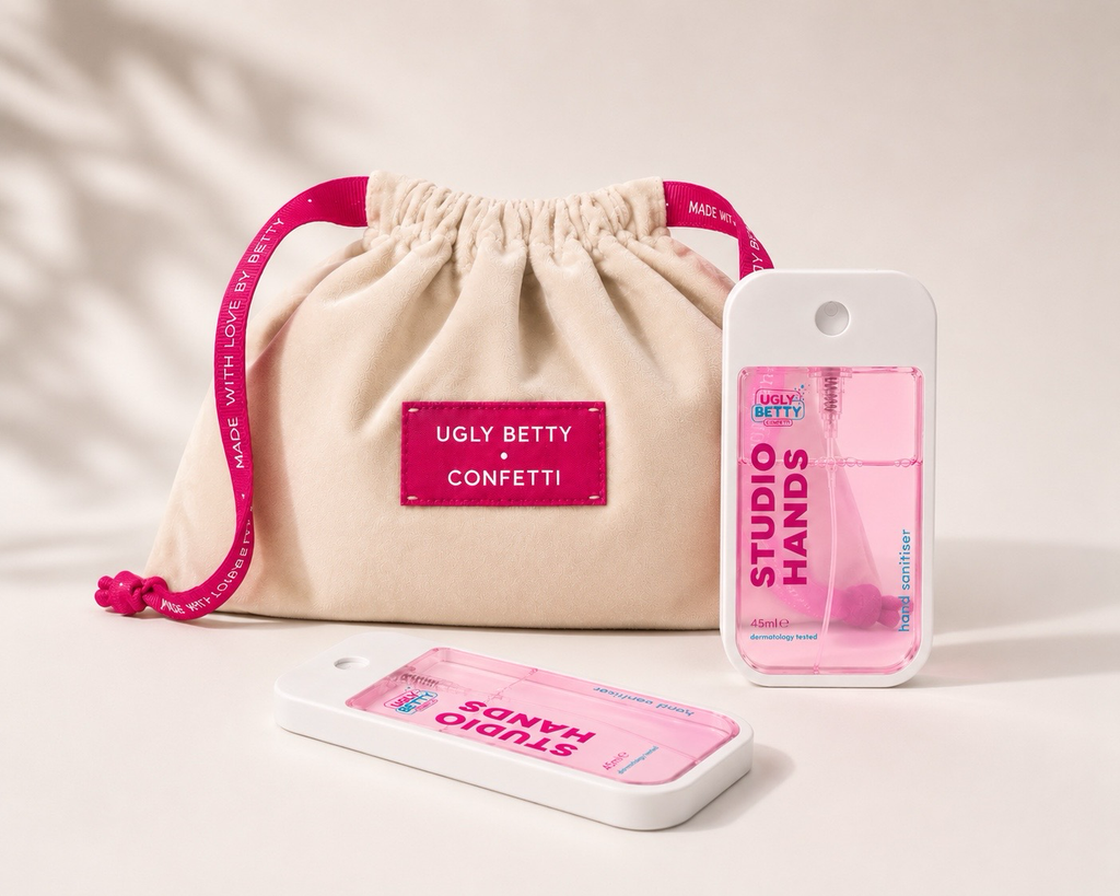 Betty's Confetti Bag open showing hot pink silk lining and Made With Love By Betty ribbon