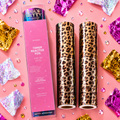 Two leopard print toner reactive foils with a pink box labeled 'Ugly Betty' on a pink background with decorative confetti.