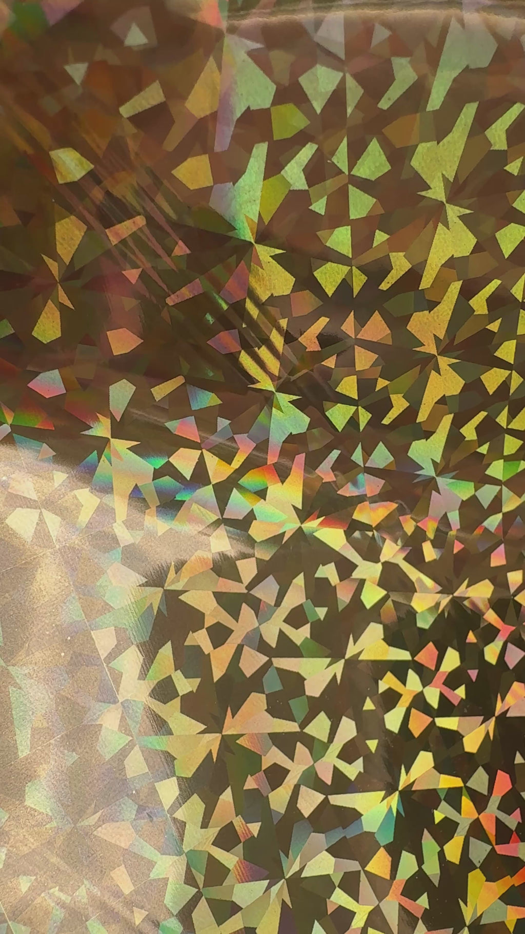 Crown Jewels gold prism holographic toner reactive foil tilting in the light, gold facets flashing rainbow