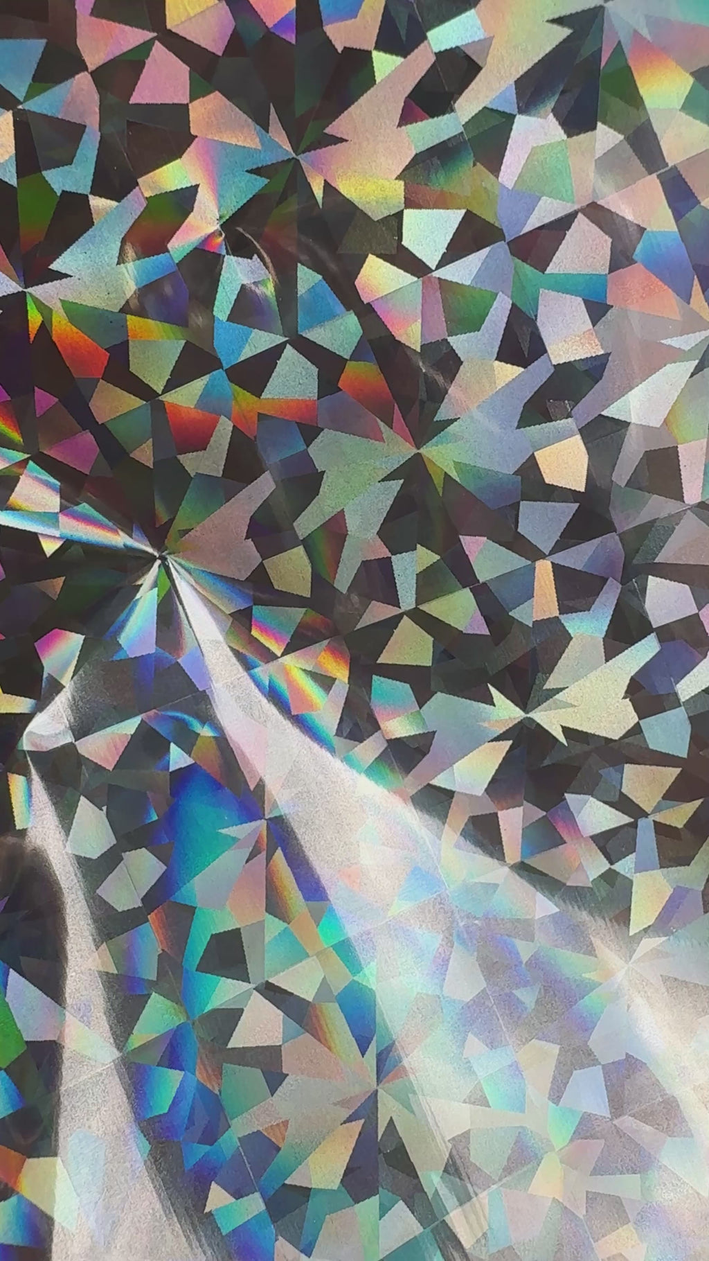 Crystal Maze silver prism holographic toner reactive foil tilting in the light, large shards flashing rainbow