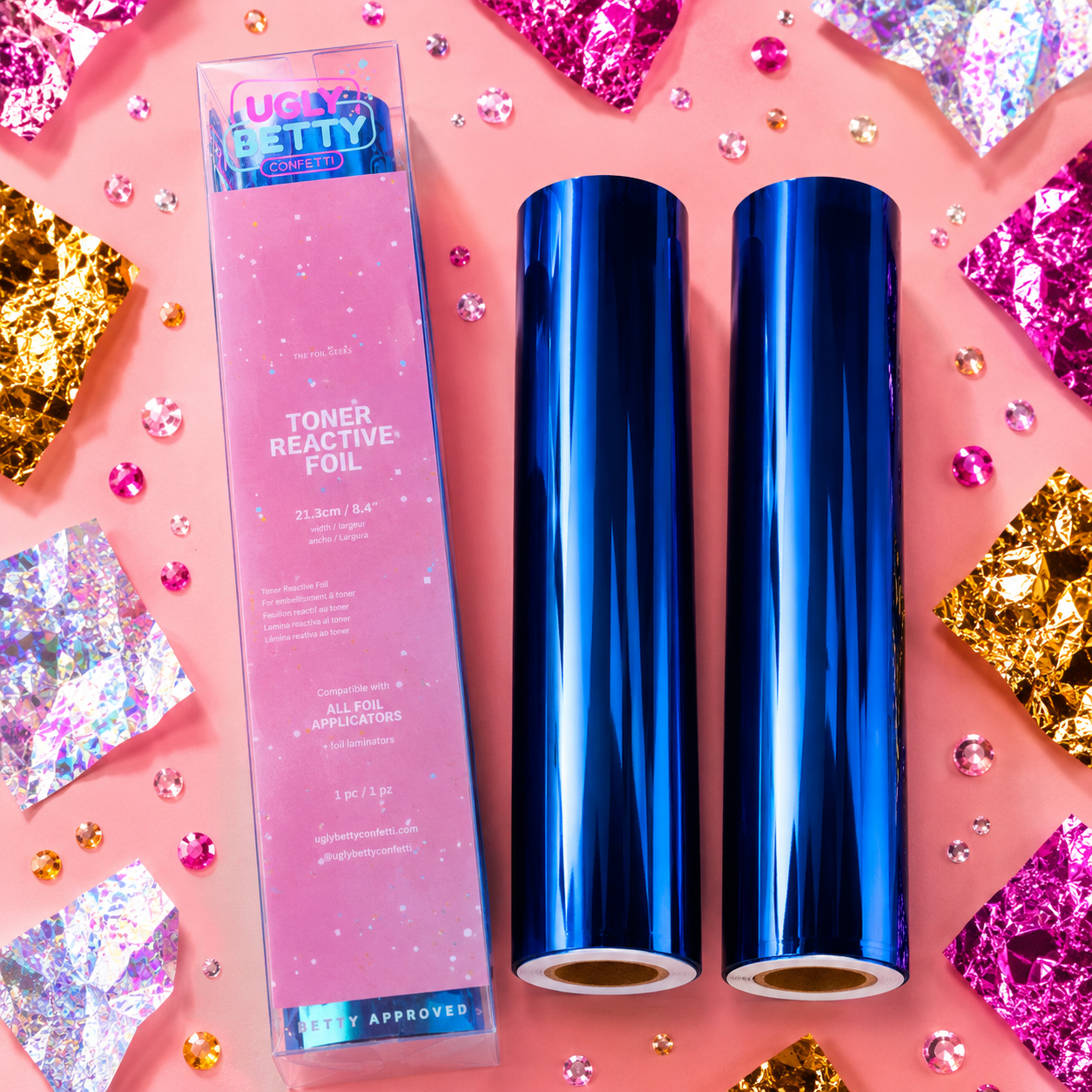 Two rolls of blue toner reactive foil with a box on a colorful background