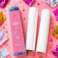 Ugly Betty toner reactive foil packaging with two rolls on a pink background with glitter.